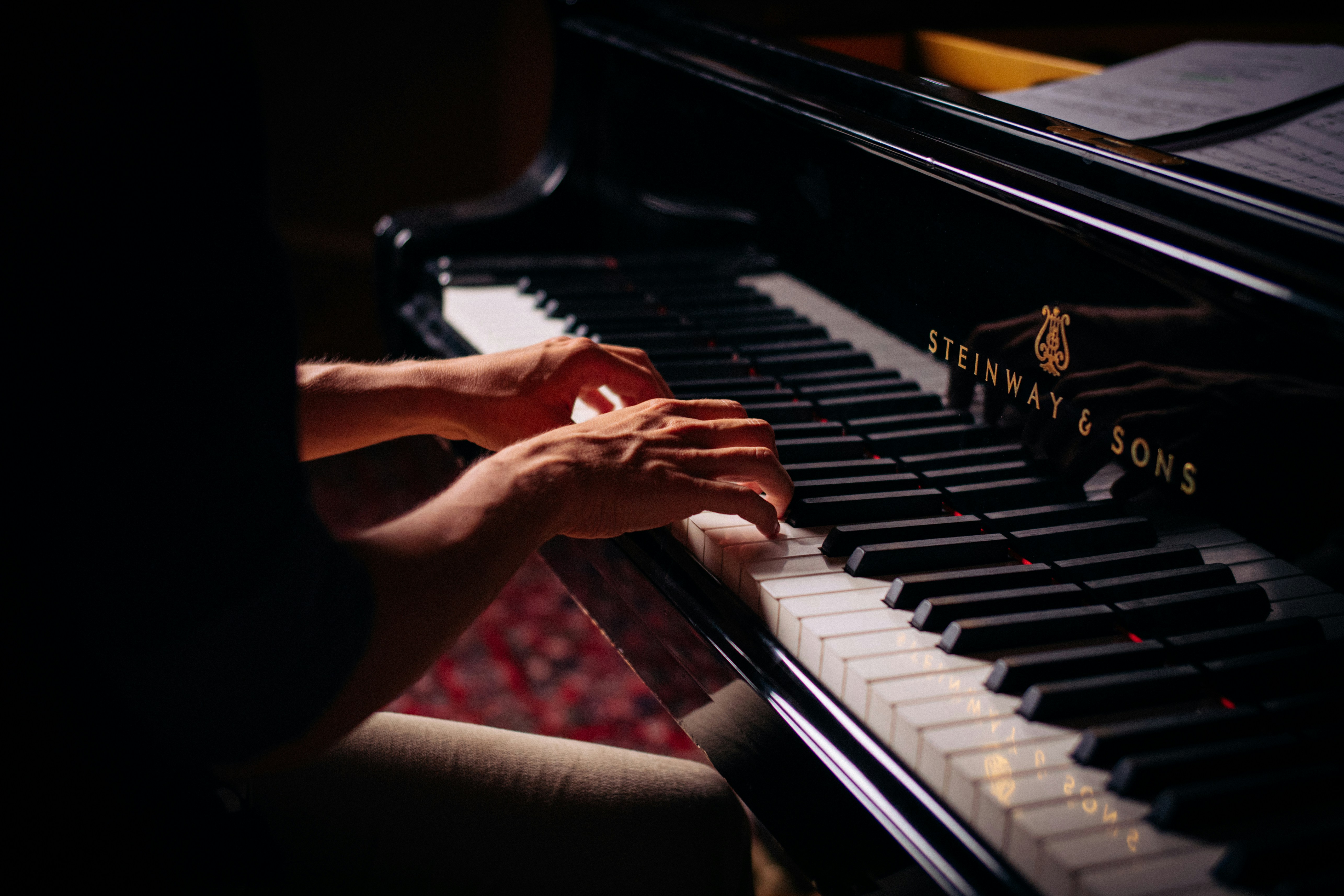 Pianist playing a grand piano